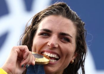 Pse olimpistët kafshojnë medaljet e arta?